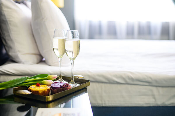 Champagne and sweet treats await guests in their room.