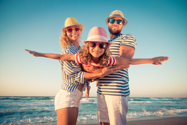 Family travelers enjoying the beach