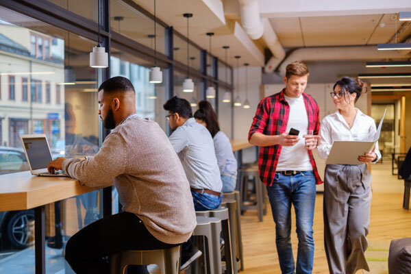 Hotel guests enjoy fast Wi-Fi service in a comfortable work-friendly lobby space.