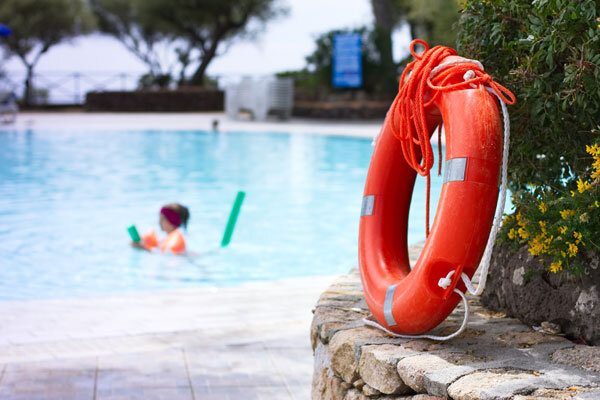 A child plays in a safely maintained hotel pool.