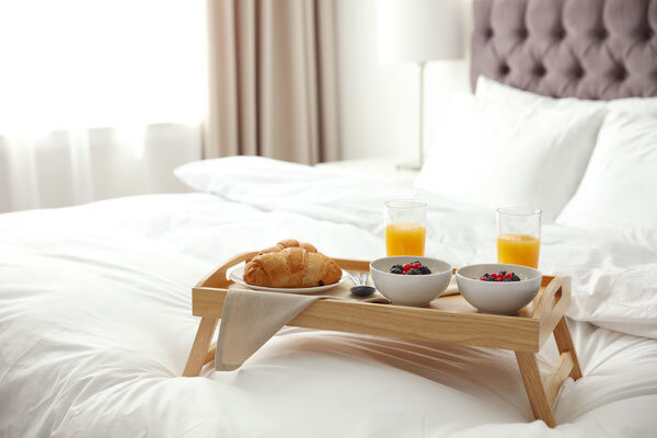 A hotel breakfast in bed for two.