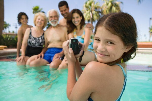 A family enjoys time in a hotel swimming pool