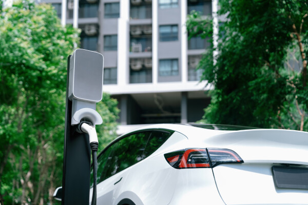 A hotel parking lot featuring an EV charging station.