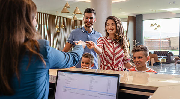 Family checking-in at hotel