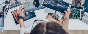 A woman carefully selects hotel photos