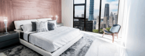 An upscale hotel room with a spectacular city view