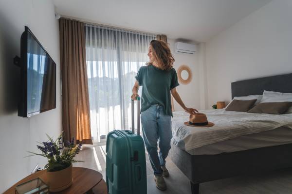 Personalized messaging welcomes a happy guest to her room